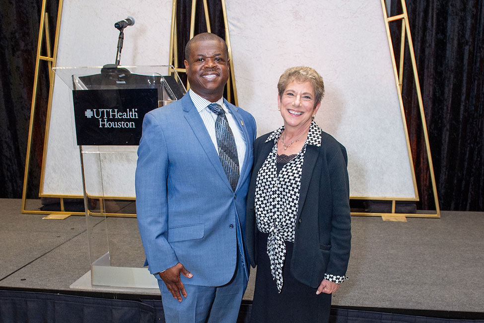 Covell Johnson, inspector for UT Police's Threat Management Team and Leslie Beckman, director of the Office of Postdoctoral Affairs, pose together at the 2023 STAR Awards banquet. (Photo by Jacob Power Photography)